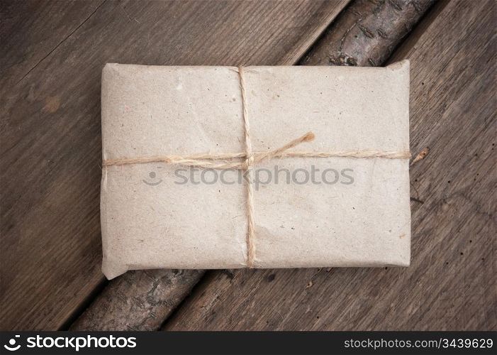 parcel wrapped with brown kraft paper and tied with twine