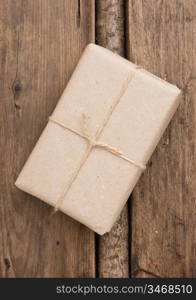 parcel wrapped with brown kraft paper and tied with twine