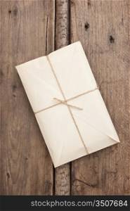 parcel wrapped with brown kraft paper and tied with twine