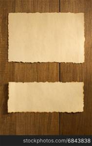 parchment paper on wood. parchment old paper on wooden background