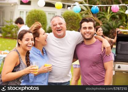 Parent With Adult Children Enjoying Party In Garden