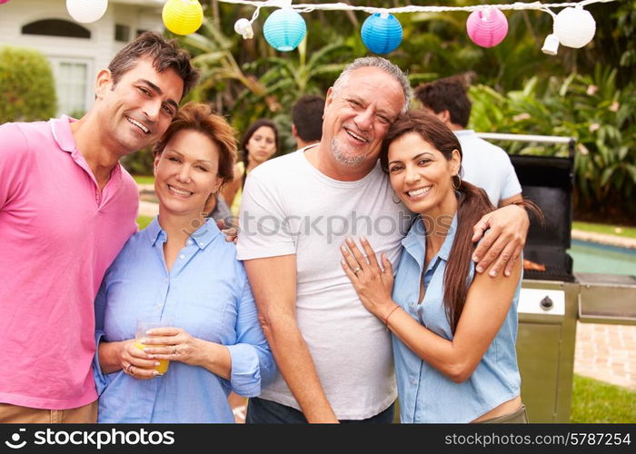 Parent With Adult Children Enjoying Party In Garden