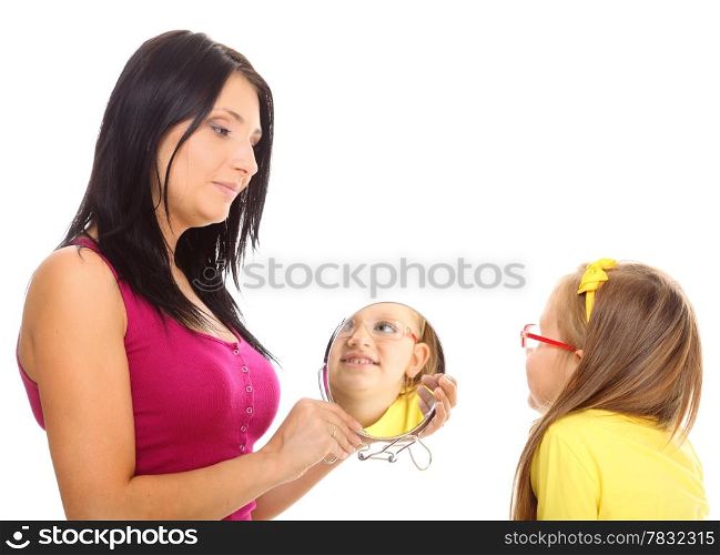 Parenthood and children upbringing. Mother and little girl with mirror on white background.