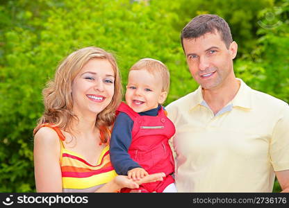 parents and child in park