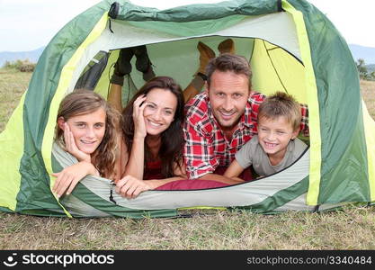 Parents and children in camp tent