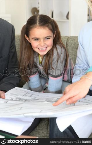 Parents and daughter having meeting with architect
