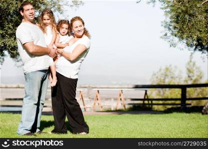Parents and their children posing for cute picture