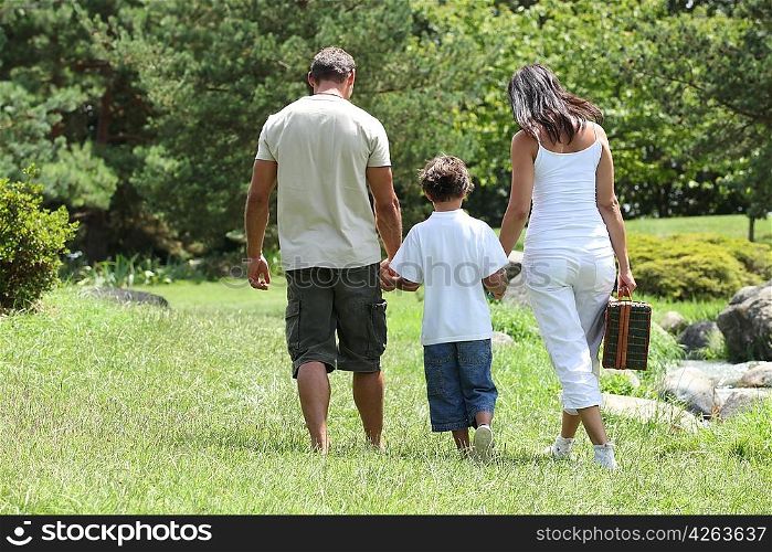 parents and their son in the park