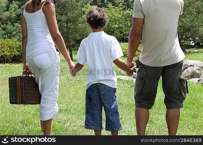 parents and their son spending time in the park