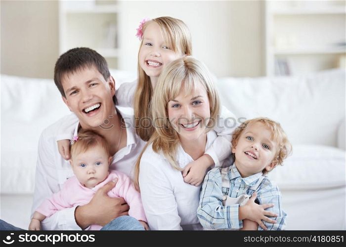 Parents and three children at home