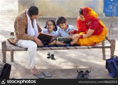 Parents assisting children with their homework