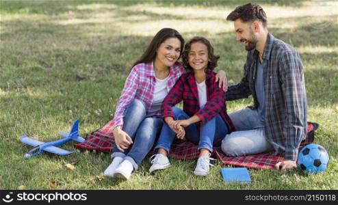 parents child spending time together outdoors