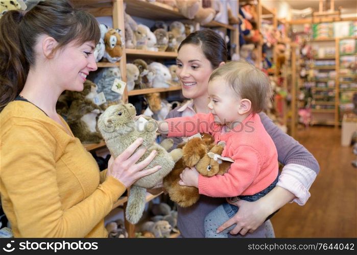 parents enjoying with their daughter in shopping mall