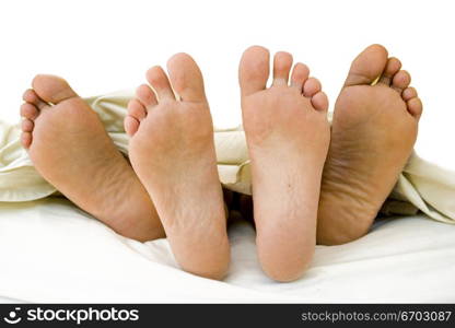 Parents feet with their new born Child