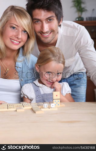 parents having fun with their little girl