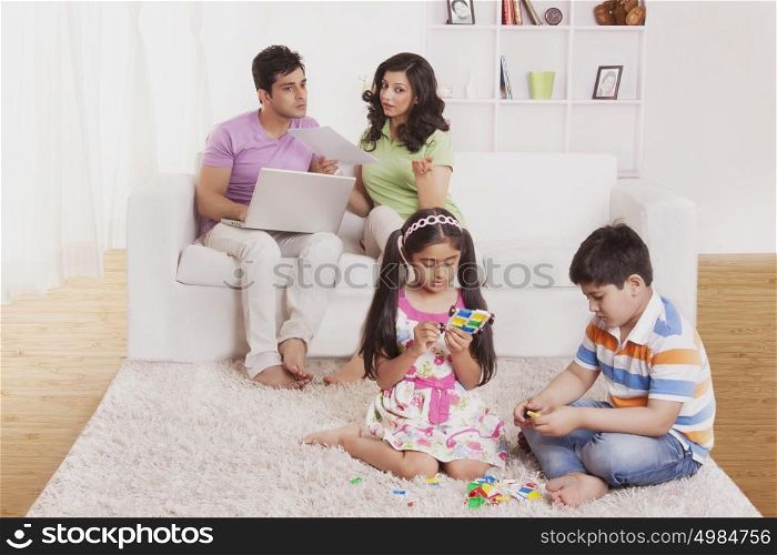 Parents looking at kids play