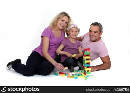 parents playing with their little girl