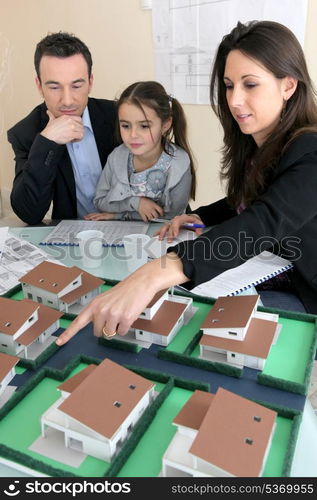 Parents showing daughter new house plans