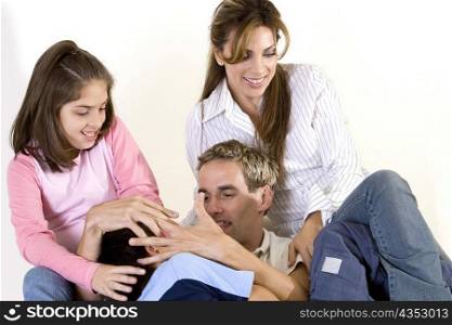 Parents sitting with their son and daughter