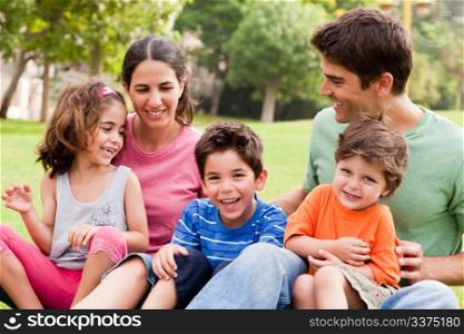 Parents spending good time with their children in the park, outdoors