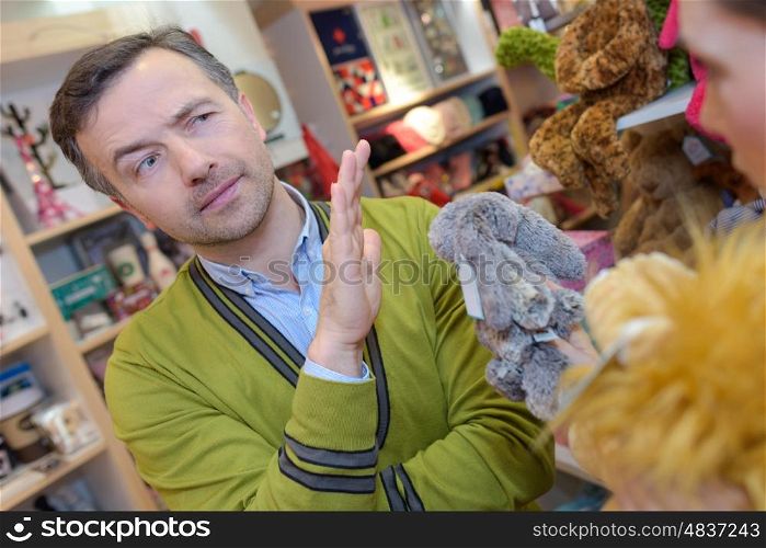 parents-to-be shopping choosing plush for their kid