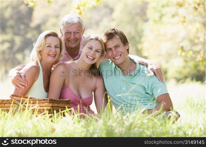 Parents with adult children on picnic