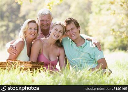 Parents with adult children on picnic