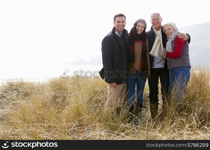 Parents With Adult Offspring Standing In Dunes