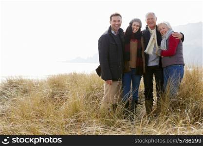 Parents With Adult Offspring Standing In Dunes