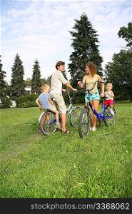 parents with child on bikes