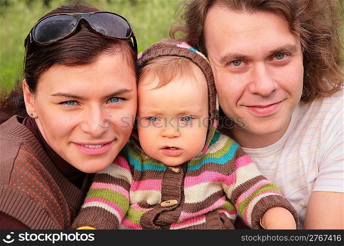 Parents with child on nature
