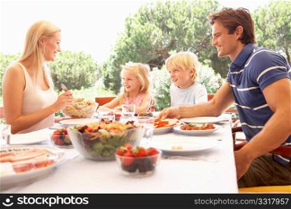 Parents, with children, enjoy a picnic