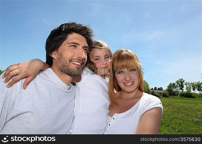 Parents with their daughter in a park