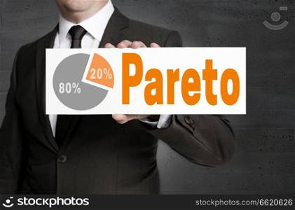 Pareto sign is held by businessman.. Pareto sign is held by businessman