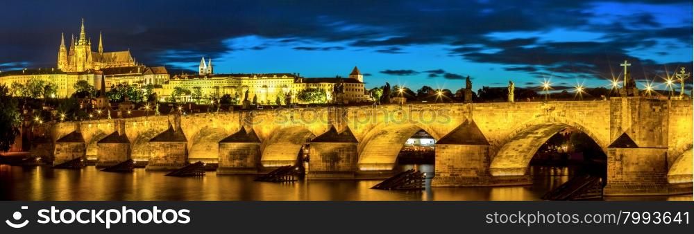Pargue at dusk, view of the Lesser Bridge Tower of Charles Bridge (Karluv Most) and Prague Castle, Czech Republic.