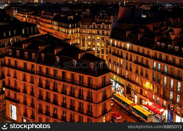 Paris. Aerial view at night.. Aerial view of the districts of Paris at night. France.