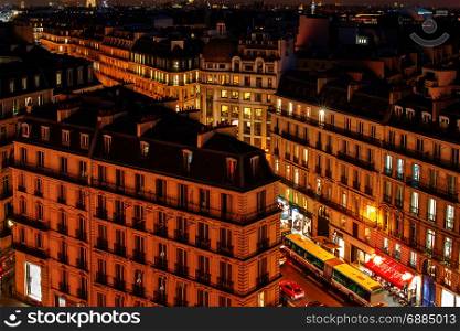 Paris. Aerial view at night.. Aerial view of the districts of Paris at night. France.
