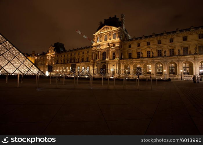 PARIS - December 3: The Louvre Art Museum on Decemver 3, 2010 in Paris. The history of this most famous museum goes back 800 years of continuous transformations from fortress to palace and today museum.