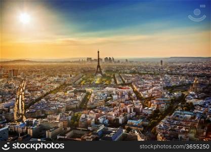 Paris, France at sunset. Aerial view on the Eiffel Tower, Arc de Triomphe, Les Invalides etc.