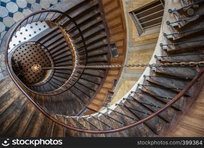 Paris, France - August 05, 2006: Beautiful vintage high spiral staircase in the gallery of Vivienne. Top view. Paris, France - August 05, 2006: Top view of the architectural element of the spiral staircase in the gallery of Vivienne