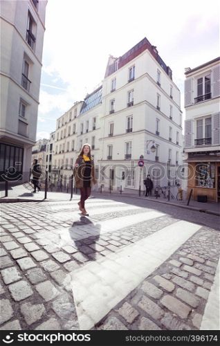 PARIS, FRANCE - MARCH 29, 2018: girl is walks around Montmartre. Paris, France