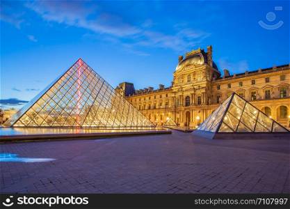 Paris, France - May 13, 2014: Louvre Museum in Paris at twilight in France