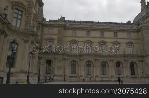 PARIS, FRANCE - SEPTEMBER 06, 2015: Steadicam shot of moving along the building of Louvre Palace. Used as a royal palace became the public museum since 1793