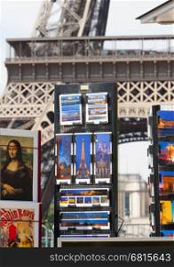 PARIS - JULY 27: Postcard stand at the Eiffel Tower on July 27, 2013, in Paris. The Eiffel Tower is the most visited tourist attraction in France and one of the most recognizable landmarks in the world.