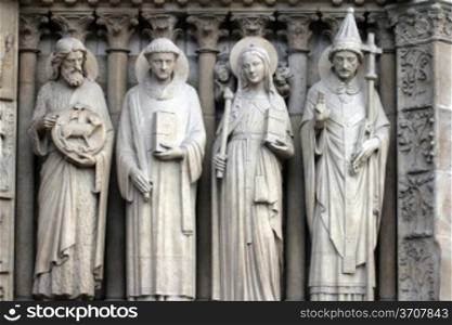 Paris, Notre-Dame cathedral, portal of the Virgin, from left to right: Saint John the Baptist, Saint Stephen, Saint Genevieve and Pope Saint Sylvester.