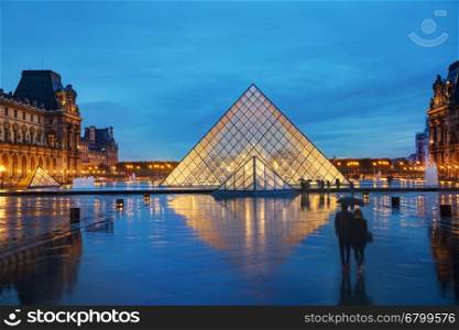 PARIS - NOVEMBER 4: The Louvre Pyramid on November 4, 2016 in Paris, France. It serves as the main entrance to the Louvre Museum. Completed in 1989 it has become a landmark of Paris.