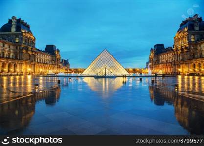PARIS - NOVEMBER 4: The Louvre Pyramid on November 4, 2016 in Paris, France. It serves as the main entrance to the Louvre Museum. Completed in 1989 it has become a landmark of Paris.
