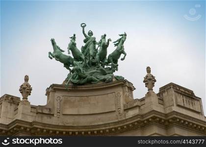 Paris. Sculpture with horses on building Grand Palais
