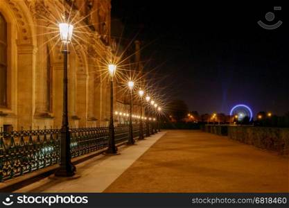Paris. Tuileries Gardens at night.. Night alley in the light of the lanterns in the gardens of the Tuileries. Paris. France.