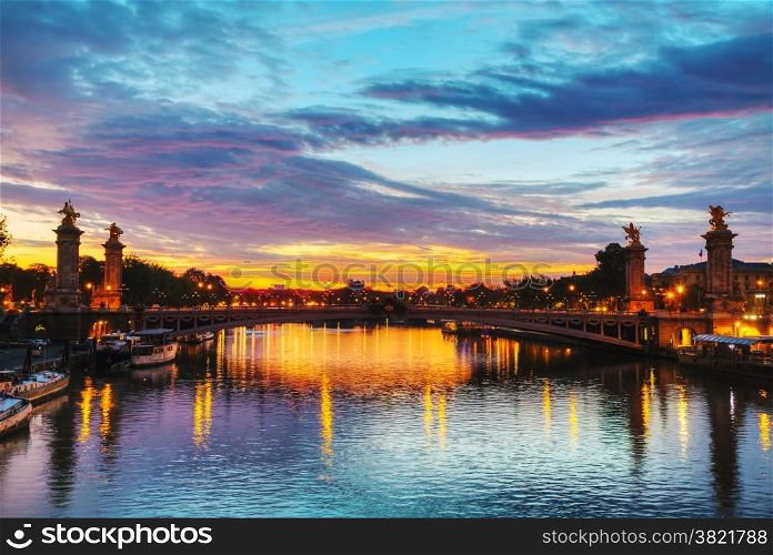 Paris with Aleksander III bridge at sunrise